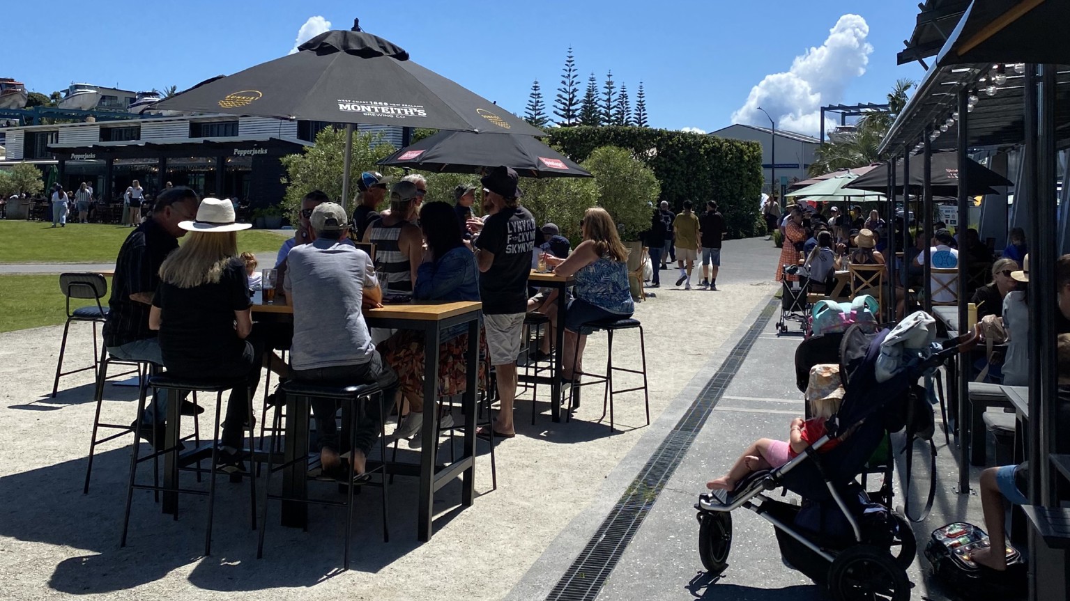 People sitting outside at a cafe in Pine Harbour.