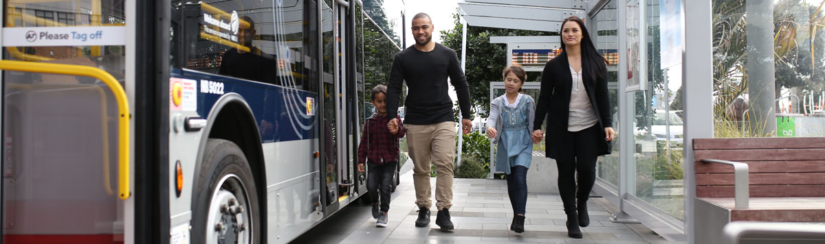 Family at a bus stop