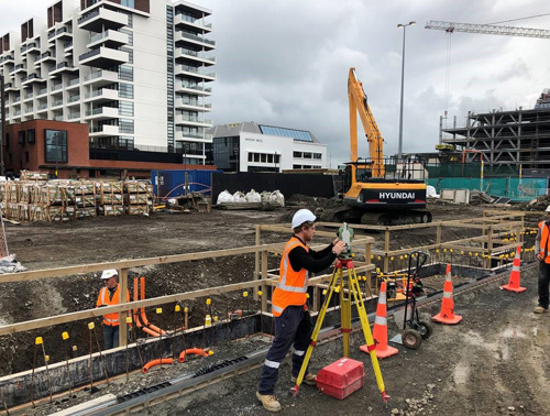 Image: Team members work near the rain gardens which will surround the neighbourhood park.