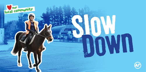 Coatesville Billboard showing woman riding a horse urging people to slow down.