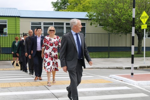 Auckland Mayor Phil Goff and Councillor Christine Fletcher lead the way on the new raised crossing on Frost Road.