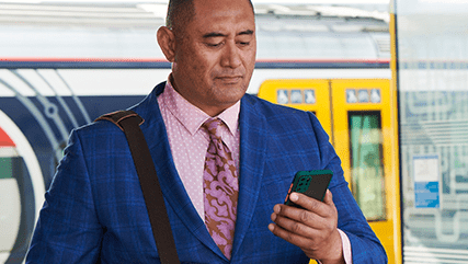 commuter using his AT Mobile app