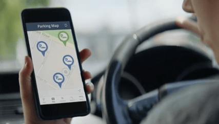 Man looking for parking using AT Park app