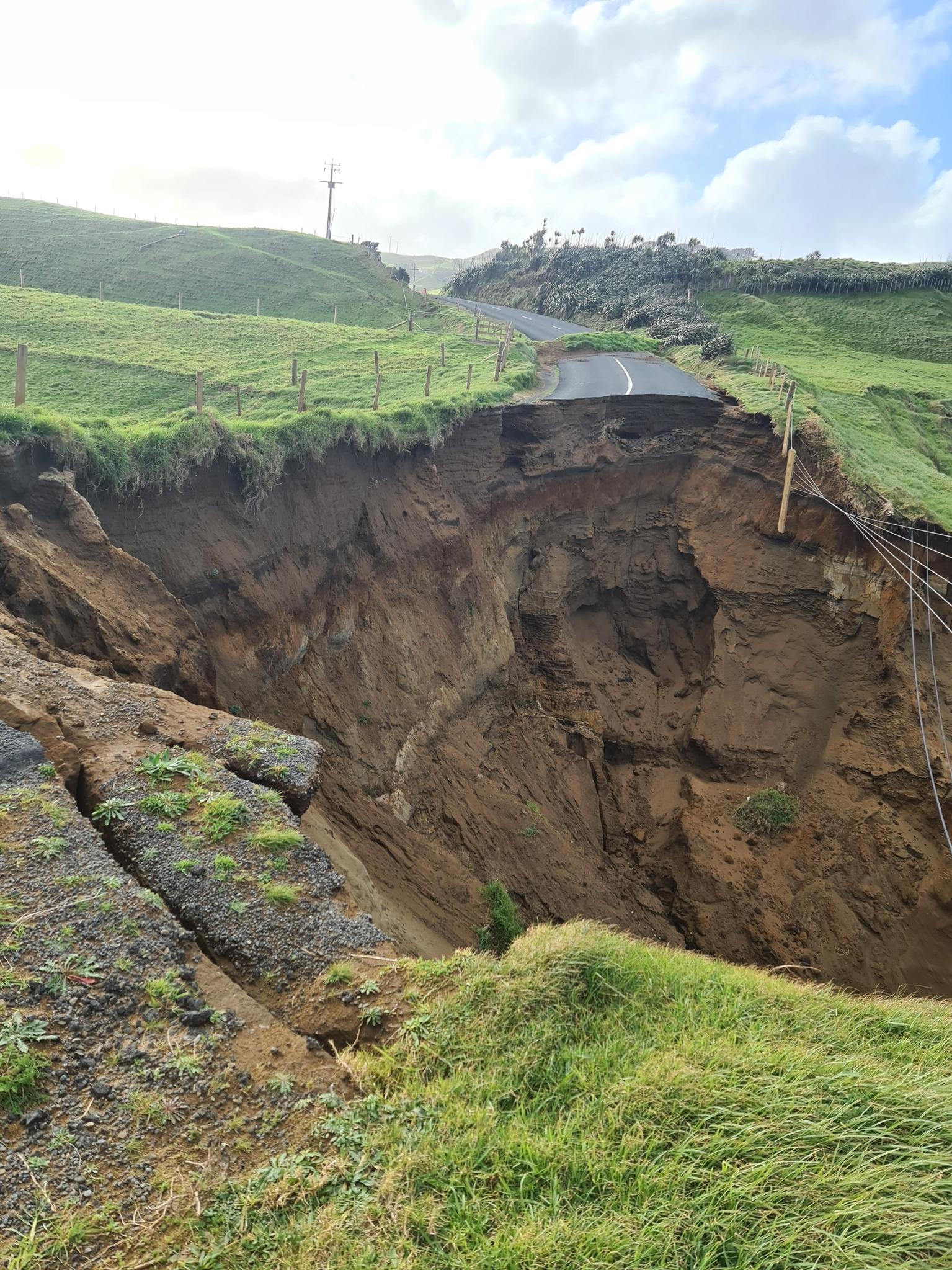 A rural road in Auckland that has been washed away by a landslide.