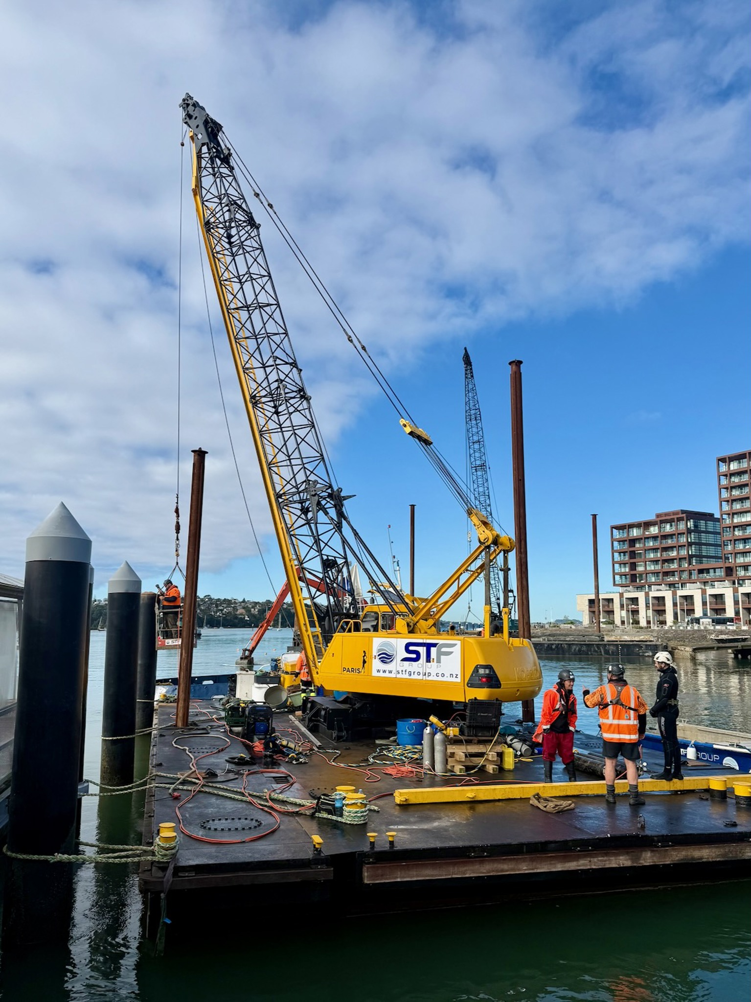 Photo of a crane on a barge at the Hobsonville Point wharf.