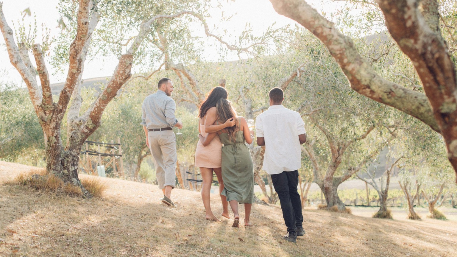 People walking amongst trees.
