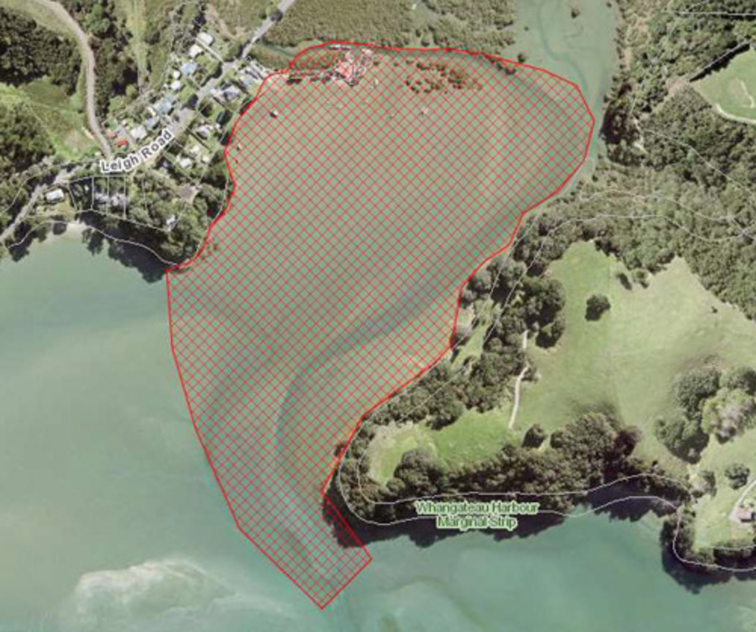 Aerial view with a large red‑outlined and cross‑hatched area near Whangateau Harbour